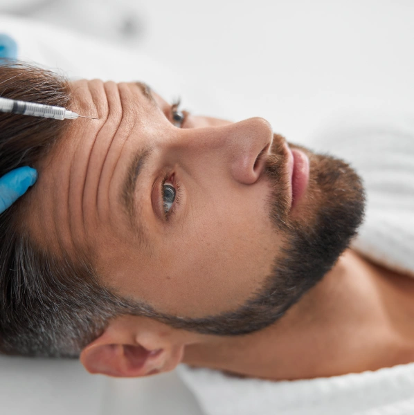 Man receiving dental examination or treatment in clinical dental setting